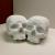 Macy Becker, Skulls, 2022, plaster and acrylic