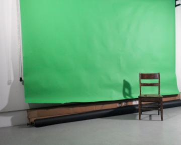 Chair in front of a green screen
